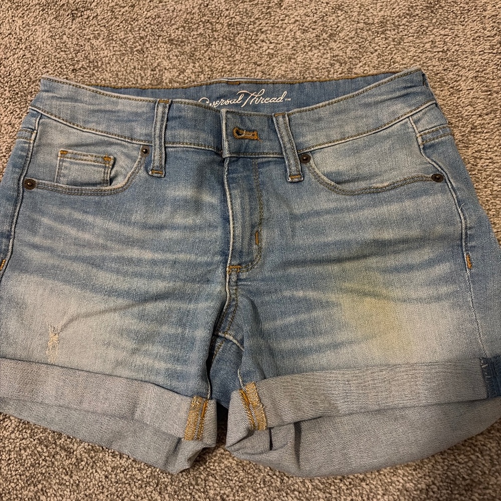 Light wash, distressed denim shorts